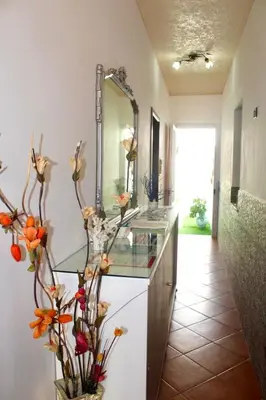 a bathroom with a sink and a mirror at Il Cortile in San Vito lo Capo