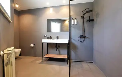 a bathroom with a sink and a shower at Villa Delle Sterlizie in Valguarnera