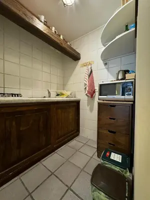 a kitchen with a sink and a counter top at Voile Rouge in Palermo