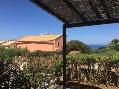 a view from the patio of a house with trees at Blu Marea in Macari