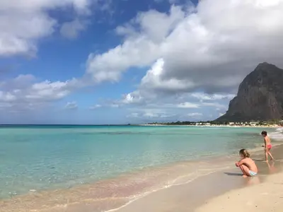 a couple of kids playing on the beach at Blu Marea in Macari