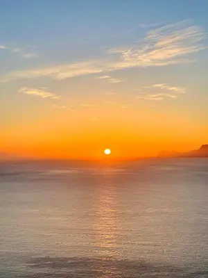 a sunset over the ocean with the sun in the sky at Casa di Cri in San Vito lo Capo