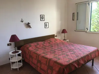 a bathroom with a shower and a white refrigerator at Villa Nadia con splendida vista mare in Castellammare del Golfo