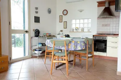 a bedroom with a bed with towels on it at Villa Nadia con splendida vista mare in Castellammare del Golfo