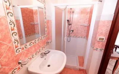 a bathroom with a sink and a shower at Hotel Concordia in Palermo