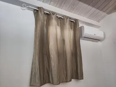 a shower curtain is hanging in a room at House Il Conte in Palermo