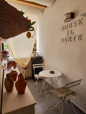 a room with a table and chairs and a table at House Il Conte in Palermo