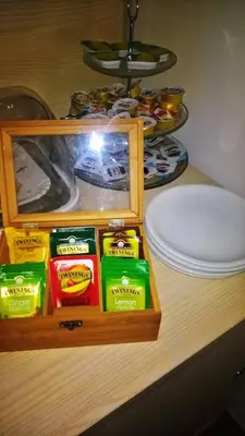 a wooden shelf with packets of food on a counter at Villa Ancora B&B in San Vito lo Capo