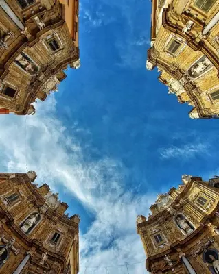 two tall buildings looking up at the sky at Liolà Home #Teatro Massimo in Palermo