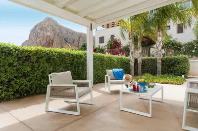 a patio with two chairs and a table with a view at Spuma di Mare - Riccio in San Vito lo Capo