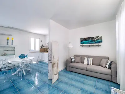 a living room with a couch and a table at Spuma di Mare - Riccio in San Vito lo Capo