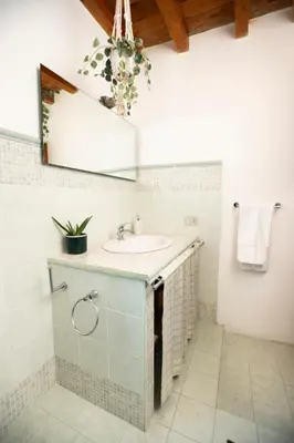 a bathroom with a sink and a mirror at Montesanto 13 in Palermo