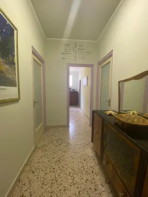 a hallway with a mirror and a sink in a room at Stella Maris in Palermo