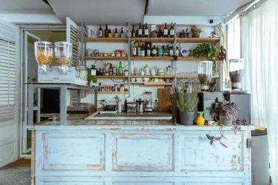 a kitchen with a counter with lots of items on it at Artisan Maison Palermo in Palermo