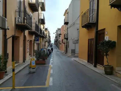 an empty street in an alley between buildings at Residence Mareluna in Castellammare del Golfo