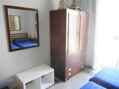 a bedroom with a mirror and a bed and a dresser at 4You in Palermo
