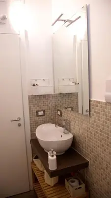 a bathroom with a sink and a mirror at Vista Capo in Palermo