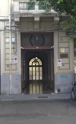 an entrance to a building with a large door at KMC suites - Purple in Palermo