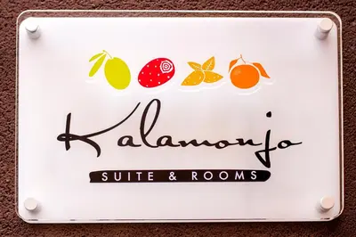 a sign for a restaurant with fruit on it at Kalamonjo Suite&Rooms in Palermo
