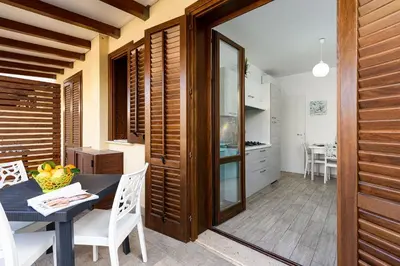 a kitchen and dining room with a table and chairs at Casa Francesco in San Vito lo Capo