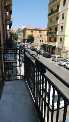 a view of a city street from a balcony at FUDDIA Room & Suite in Palermo
