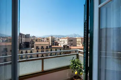 a balcony with a view of a city at Mille e una Notte / Station Apartment in Palermo