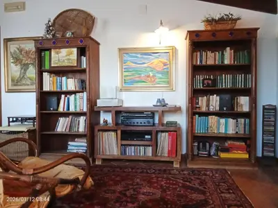 a living room with a couch and a table at Villa Amalia - mansarda B&B in Cinisi