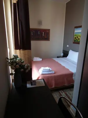 a hotel room with a bed with a red blanket at Sky Sleeping in Palermo