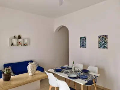 a dining room with a table and chairs at Casa Vacanze Sea-Life in Alcamo Marina