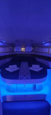 a bed in an airplane with a blue light at Desirè Charming House Boat in Palermo