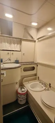 a small bathroom with a sink and a toilet at Desirè Charming House Boat in Palermo