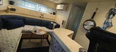 a small room with a bed and a table at Desirè Charming House Boat in Palermo