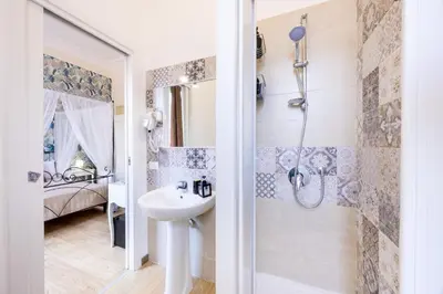 a bathroom with a sink and a shower at Il Sonaglio in Palermo