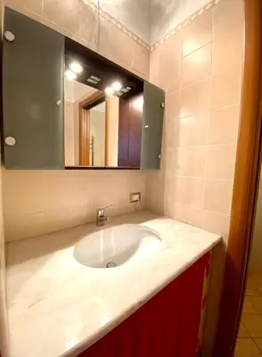 a bathroom with a sink and a mirror at Elegante appartamento in centro in Palermo