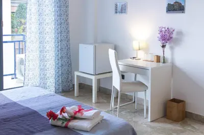 a bedroom with a desk and a bed with a chair at Darrè in Palermo