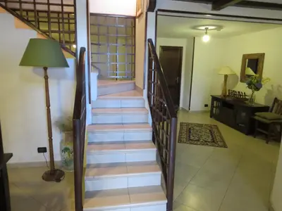 a staircase leading up to a house with a living room at Casale Giulietta in Scopello