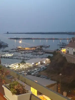 a view of a marina with boats in the water at By the Sea in Terrasini