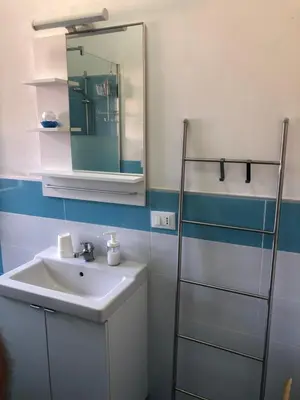 a bathroom with a sink and a mirror at Villa Violetta in Carini