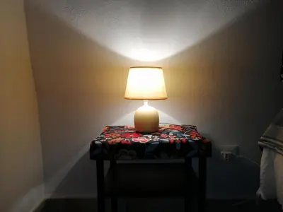 a lamp sitting on a table in a room at Camerini di Santa Cecilia in Palermo