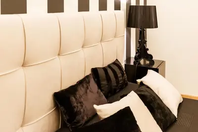 a white couch with pillows on it next to a lamp at BB 22 Charming Rooms & Apartments in Palermo