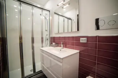 a bathroom with a sink and a shower at Casa degli Artisti San Lorenzo in Mezzojuso