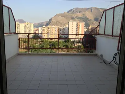 a balcony with a view of a city at Oreto Bridge in Palermo