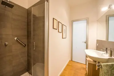 a bathroom with a sink and a shower at Charming Apartment in the City Center by Wonderful Italy in Palermo