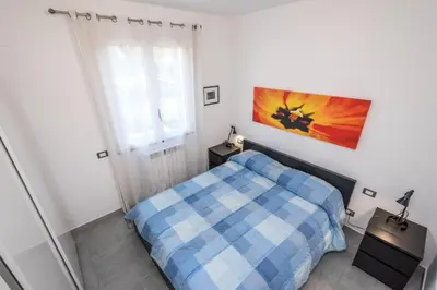 a small bedroom with a bed and a window at Villa Francesco...graziosa, moderna, confortevole! in Lascari