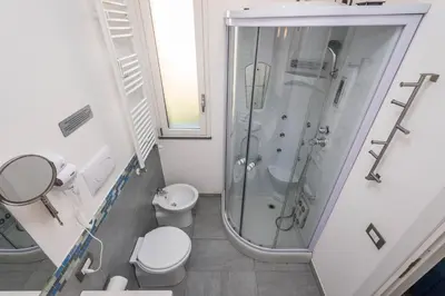 a bathroom with a shower and a toilet and a sink at Villa Francesco...graziosa, moderna, confortevole! in Lascari