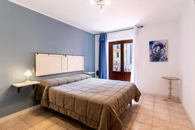 a bedroom with a bed and a projection screen at Arianna's House Historical Market in Palermo