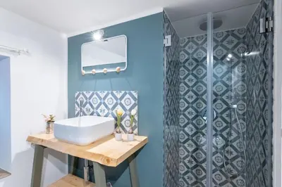 a bathroom with a sink and a shower at Arianna's House Historical Market in Palermo