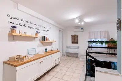 a kitchen with a desk in a room at Arianna's House Historical Market in Palermo