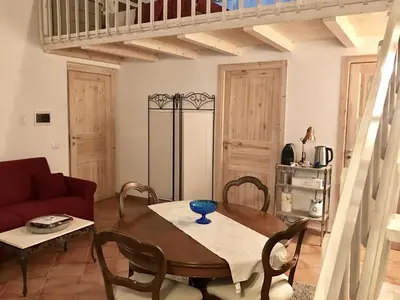 a living room with a table and a couch at Casa Vigliena in Palermo