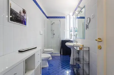 a bathroom with two toilets and a sink and a shower at Luxury Apartment * Immo's House* in Palermo
